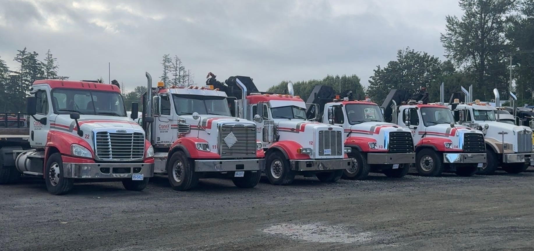 CraneX picker trucks and tractor units lined up in the Abbotsford yard