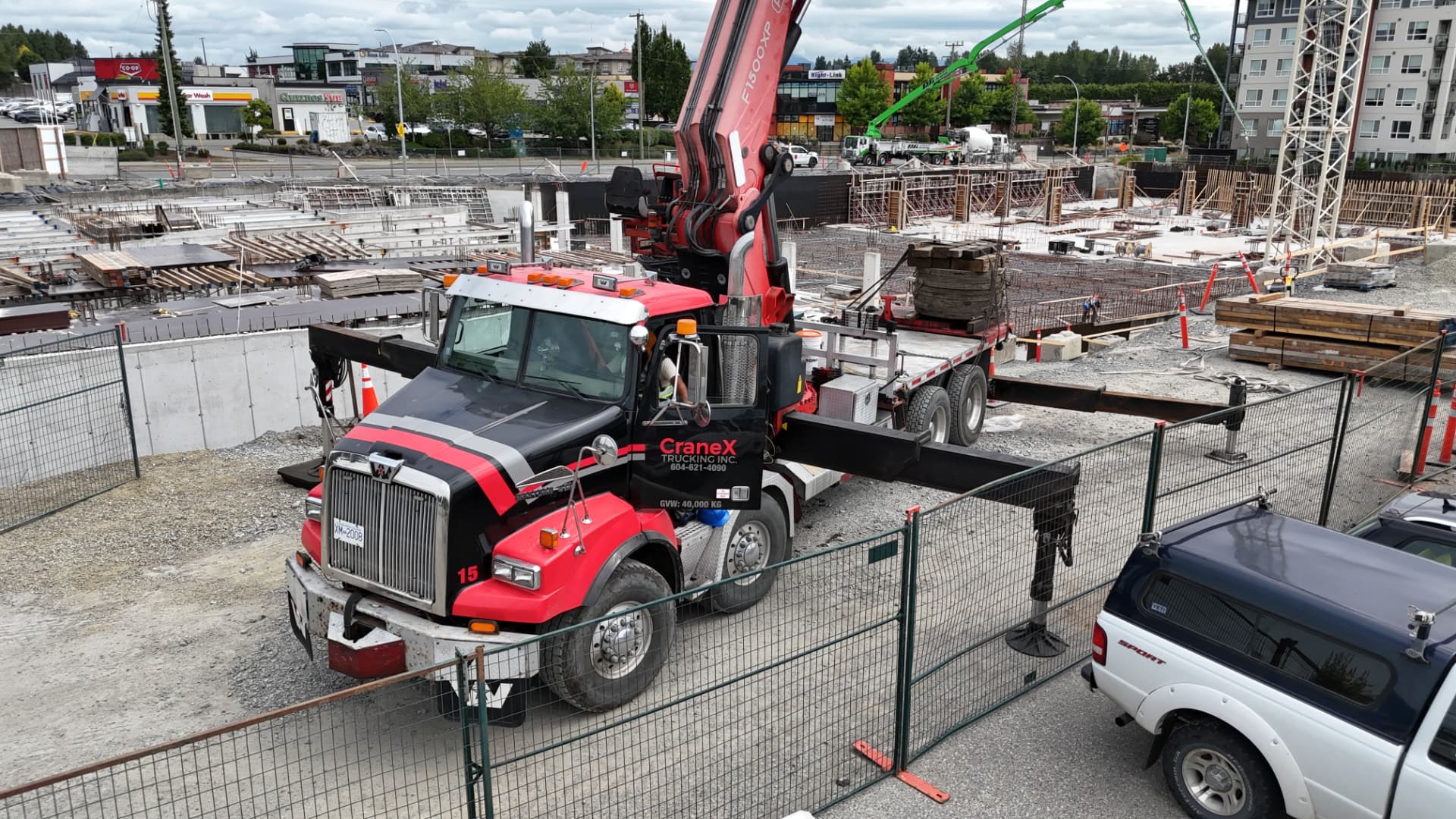 CraneX picker truck working a multi-family construction site in Abbotsford