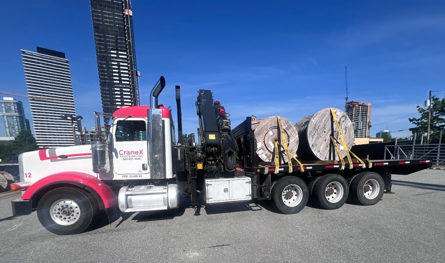 CraneX picker truck loaded with large cable and wire reels