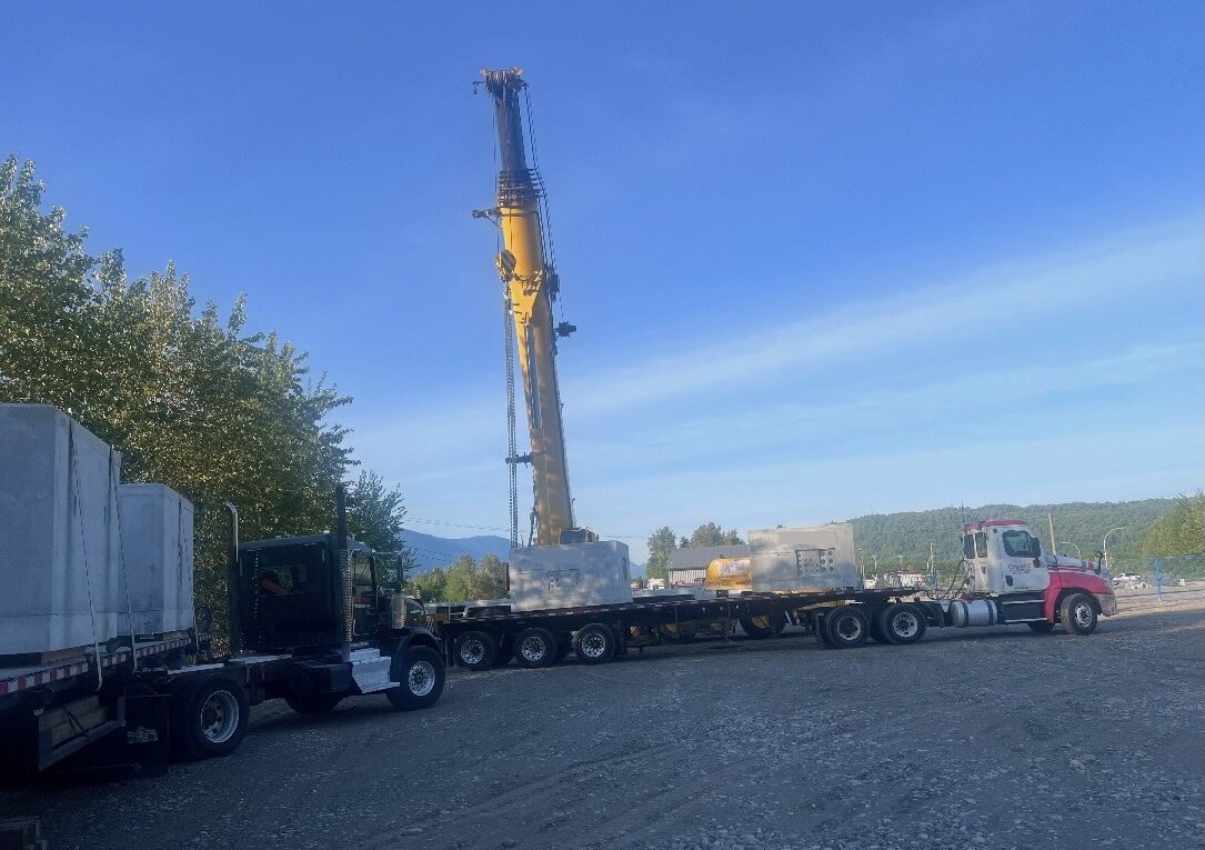 CraneX hydraulic picker crane set up for a lift on a residential street